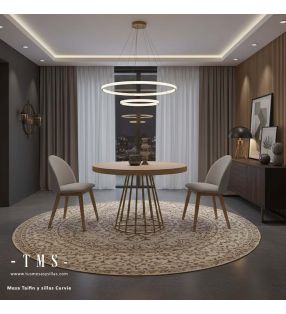 Table de salle à manger élégante avec un pied central en métal doré