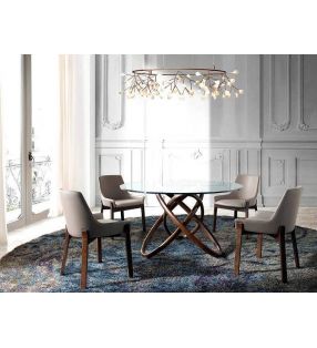 Mesa redonda de comedor en Nogal y encimera de cristal